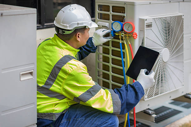 Professional Air Conditioning Repair technician working in Fredericksburg, VA